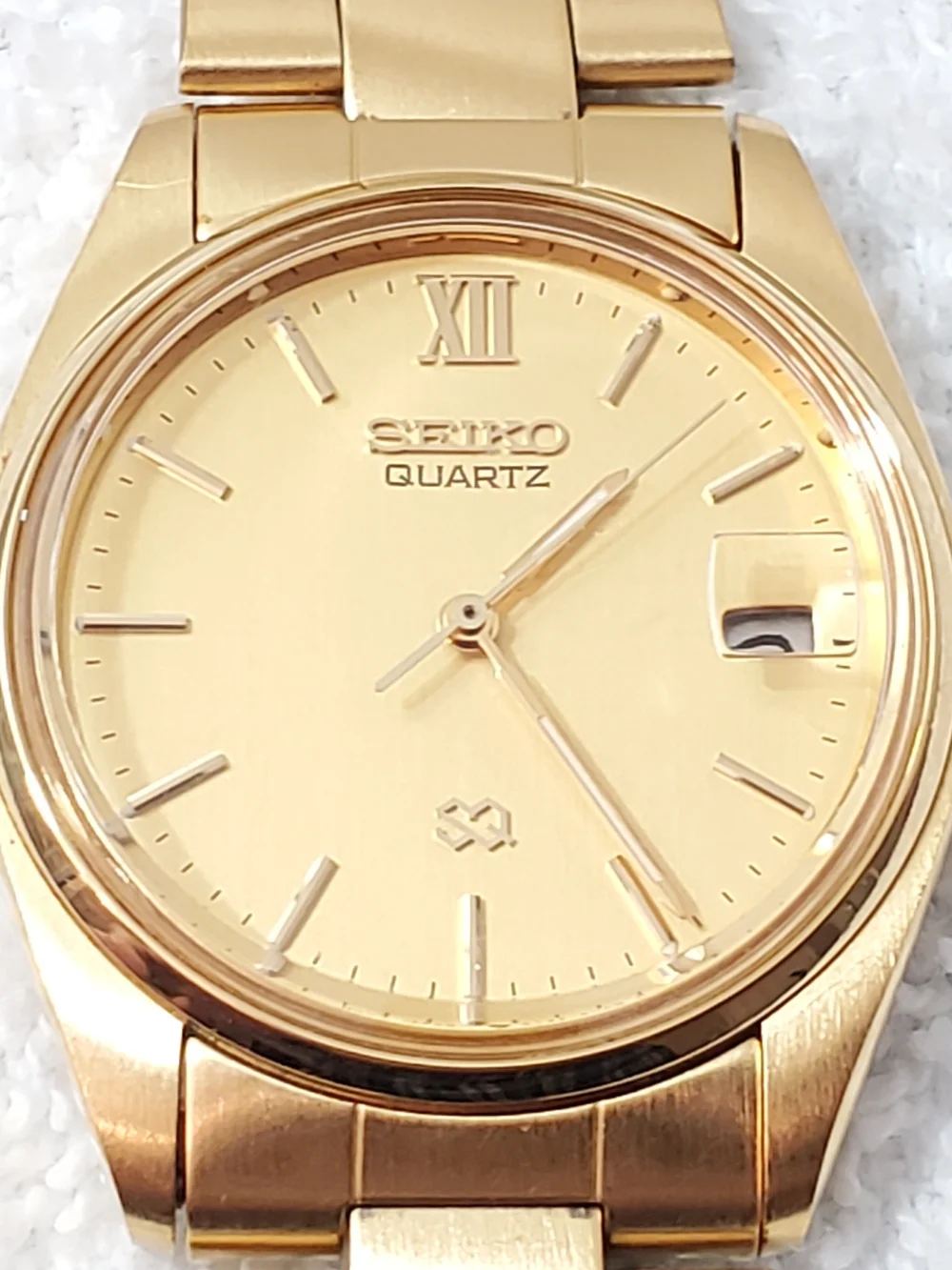 Seiko SQ Vintage Men's Gold Tone Date Quartz Watch Roman Numeral One Jewel